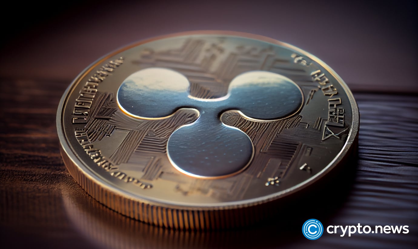 crypto news cryptocurrency Ripple crypto Xrp Coin crypto coin with the image of Ripple XRP lies on the table