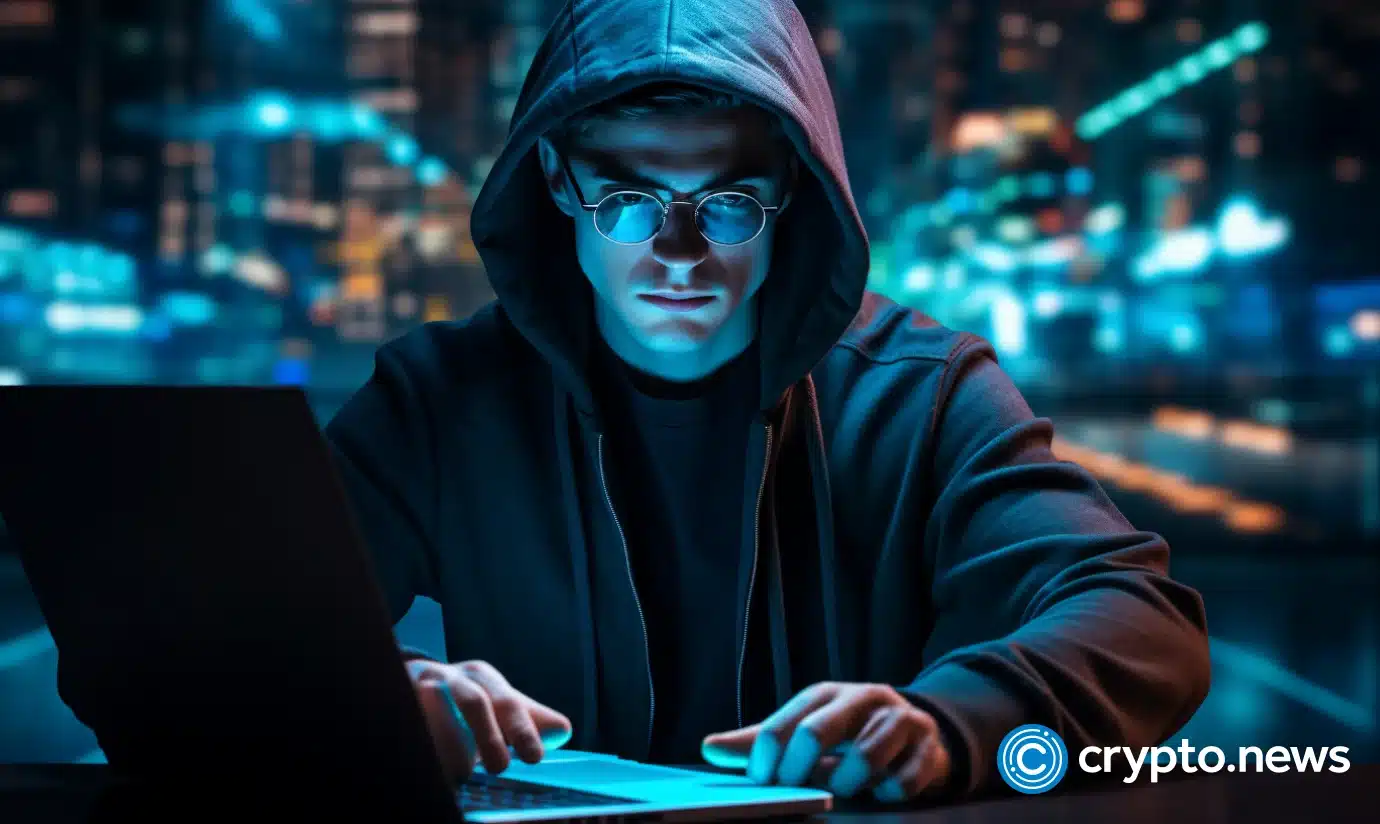 crypto news hacker watch on his laptop blue flame on the screen matrix blue program code Decentralization blockchain system background02